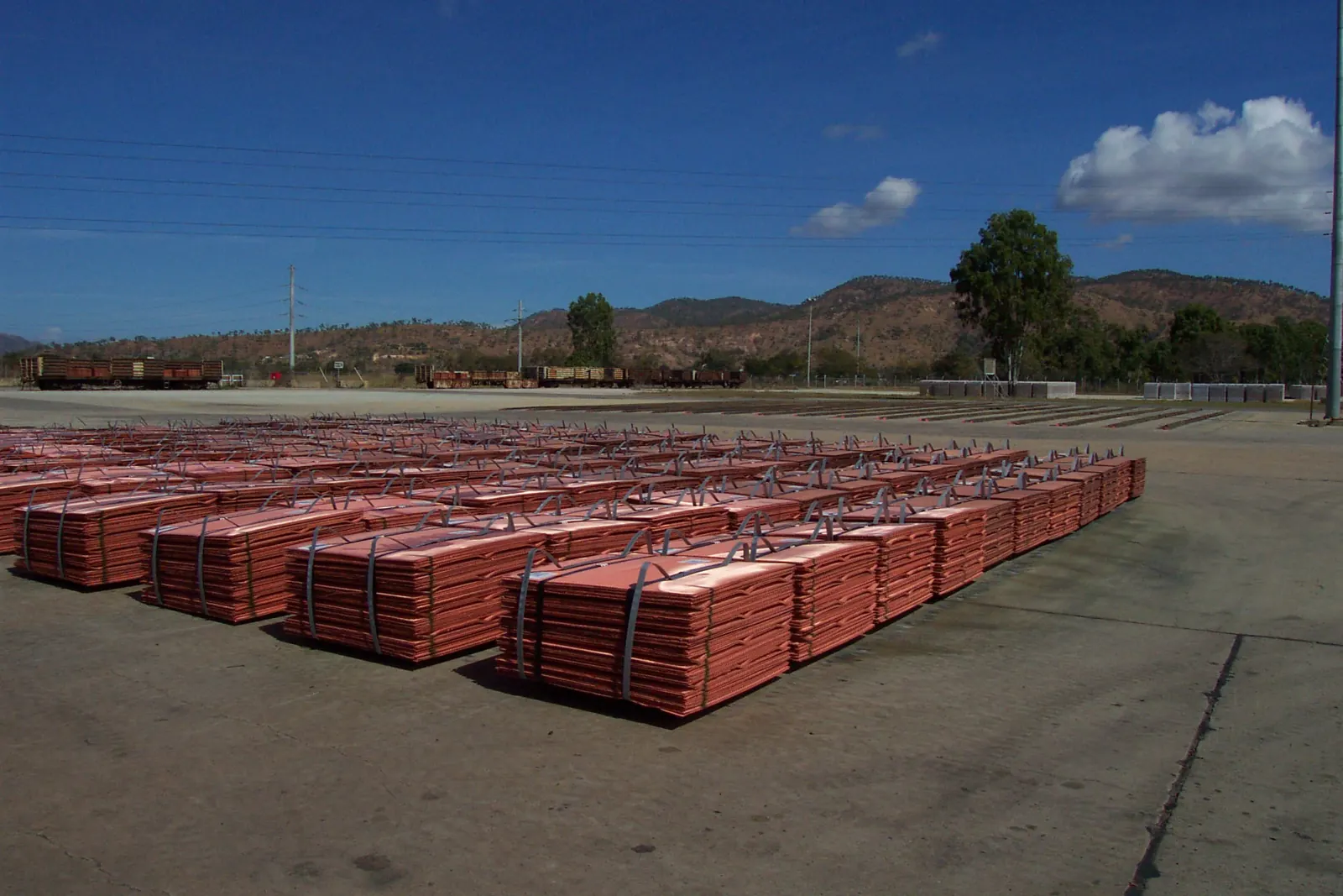 Bundled copper cathode sheets stacked in a storage yard
