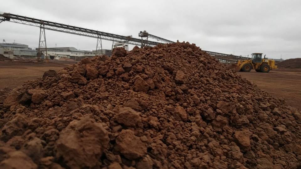 Pile of iron ore lumps at a mine loading yard
